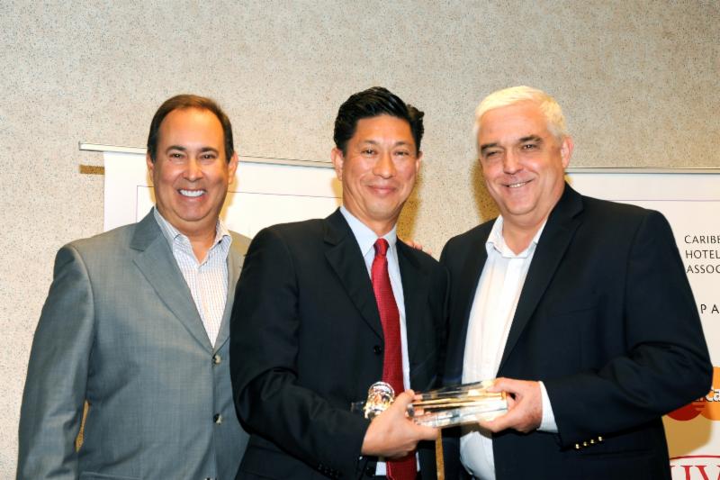  Photo caption: The Caribbean Hotel and Tourism Association (CHTA) inaugurated Emil Lee (pictured center), general manager of Princess Heights Hotel, St. Maarten, as the new president at its Annual General Meeting (AGM) on July 1, 2014. Richard J. Doumeng, (pictured right), immediate past president of CHTA and managing director of Bolongo Bay Beach Resort, St. Thomas, USVI, ceremoniously turns over the gavel to Lee along with Jeffrey S. Vasser, CHA, director general and CEO of CHTA.
