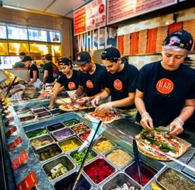 Employees at a Blaze Fast-Fire'd Pizza restaurant
