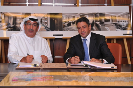 Waleed Alsharian, Chief Executive Officer of Mabanee Company K.P.S.C (left), and Carlos Khneisser, Vice President Development ME & North Africa, Hilton Worldwide, sign the agreements for Conrad and Hilton Garden Inn hotels at The Avenues Mall, Kuwait: Conrad Hotels & Resorts.