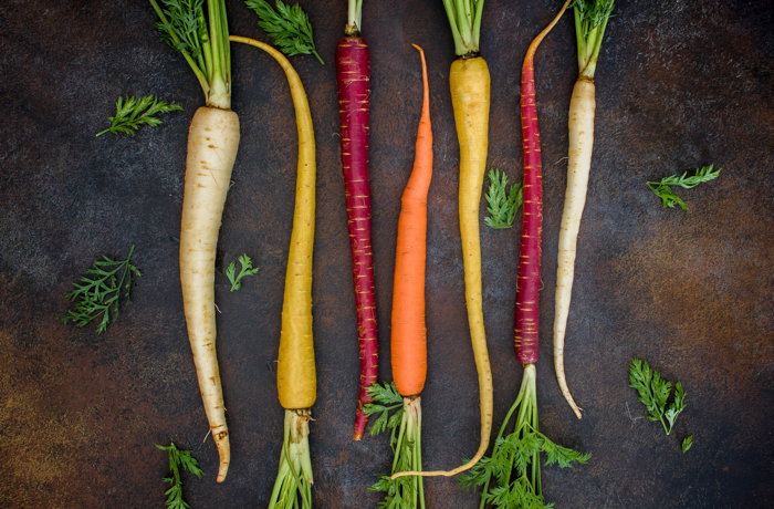 Seven assorted varieties of baby carrots - Photo by Dana DeVolk on Unsplash