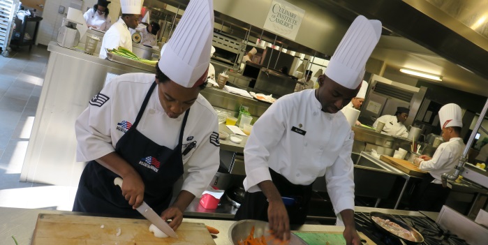 Military foodservice professionals prepare dishes - Source National Restaurant Association