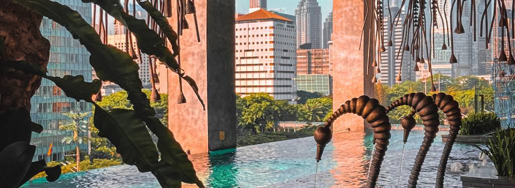 Modern infinity pool in Jakarta, Indonesia. The Orient Jakarta Hotel 